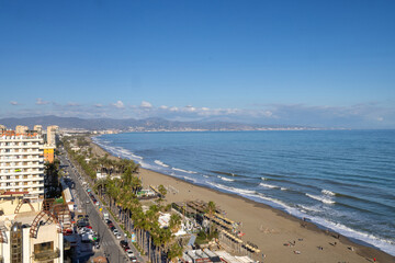 Aerial photo of the beach front in the Spanish town of Torremolinos in Spain showing the ocean beach front and hotels and apartments on the beach front on a sunny day