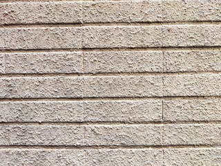 Textured gray wall featuring horizontal lines and space for text, suitable for design projects and presentations