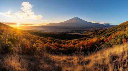 紅葉に染まる山麓と光芒が広がる秋の富士山と黄金色の夕日