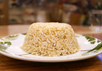 Plate of Aromatic Steamed Thai Brown Rice for the Concept of GOOD CARBS