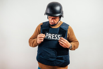 Reporter with bulletproof vest on white background.