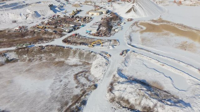 James dick quarry in caledon village covered in snow, with machinery visible, aerial view