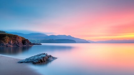 Obraz premium Serene sunset over coastal landscape beach tranquil environment wide angle natural beauty