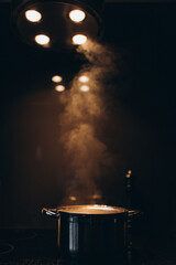 Cooking at home, pot with boiling water