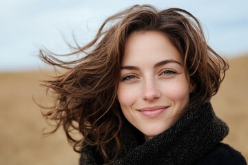 Fototapeta premium Happy Woman Enjoying the Outdoors with Windblown Hair