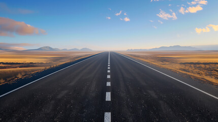 Fototapeta premium Endless Desert Highway Landscape with Clear Blue Sky and Distant Mountains Photograph
