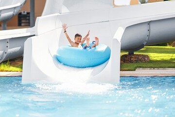 Boy having fun on water slides in Egypt Hurghada