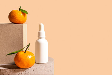 Vitamin C serum bottle and tangerine citrus