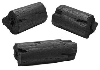 Fototapeta premium Three pieces of black charcoal with rough, natural texture, isolated on a white background