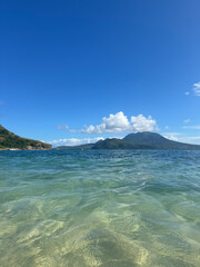 landscape with blue sky, sea, and clouds