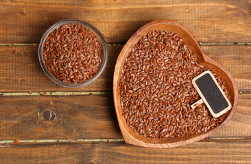 bowls with flax seeds on a rustic background