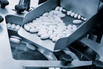 Pharmaceutical production line, production of tablets or vitamins manufacturing, tablet conveyor
