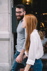 Happy couple walking on city street