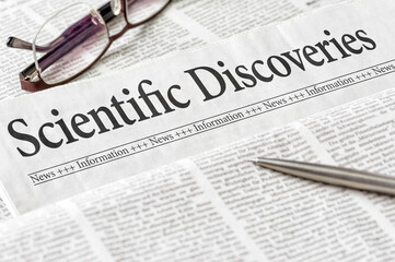 A newspaper with the headline Scientific Discoveries