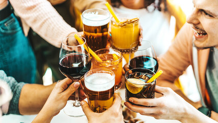 Close up image of hands holding cocktail glasses at bar restaurant - Young people having fun...
