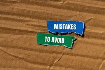 Mistakes to avoid message written on ripped torn paper pieces with cardboard background. Conceptual mistakes to avoid symbol. Copy space.