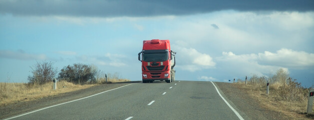 Truck driving at the highways. Transportation. Delivery