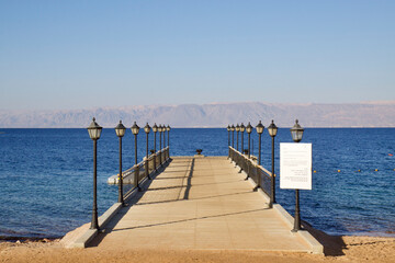 Fototapeta premium Relax on the beach with umbrellas and sun loungers