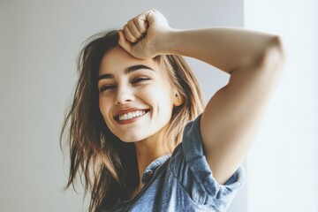Fototapeta premium Smiling woman posing in soft morning light with casual attire