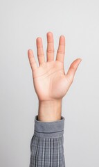 Hand Gesture with Open Palm Against a Neutral Background Representing Communication and Request for Attention