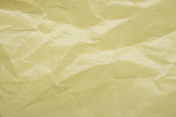 Crumpled yellow paper background creased craft paper texture