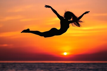 Black silhouette of an artist mid leap against a sunset.
