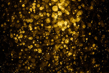 Blurred photo with golden dots visible glittering, shining brightly look and feel luxurious