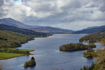 Scenic view of Queen's View overlooking Loch Tummel and surrounding landscapes in Scotland during a cloudy day