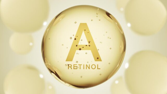 A golden glossy sphere representing Vitamin A Retinol. Dietary supplement. Medical or pharmacy concept