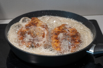 Frying horseshoe fish in a pan.
