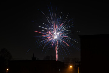 Fireworks behind the building in the background.
