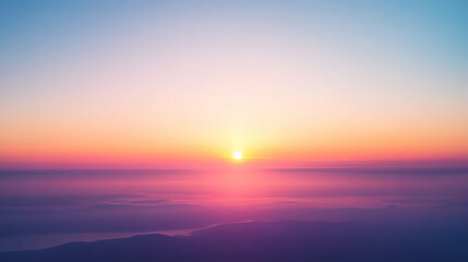 Fototapeta premium Serene sunrise over a misty landscape, showcasing vibrant pastel hues of pink, orange, and purple. A breathtaking aerial view.