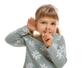 Little girl showing hand to ear gesture on white background