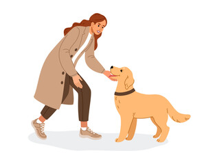 A young woman is bending down to her cute dog to play and pet it. The dog owner and her pet are happy to see each other.