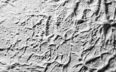 Sliding stone plaster in the image of a lifeless cold desert in the form of abstraction
