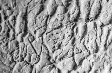 Sliding stone plaster in the image of a lifeless cold desert in the form of abstraction