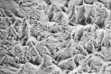 Sliding stone plaster in the image of a lifeless cold desert in the form of abstraction