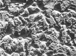 Sliding stone plaster in the image of a lifeless cold desert in the form of abstraction