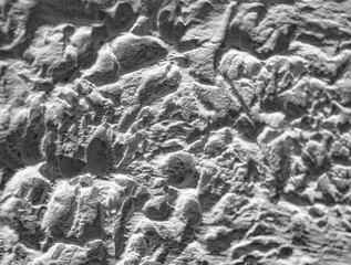 Sliding stone plaster in the image of a lifeless cold desert in the form of abstraction