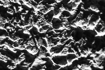 Sliding stone plaster in the image of a lifeless cold desert in the form of abstraction