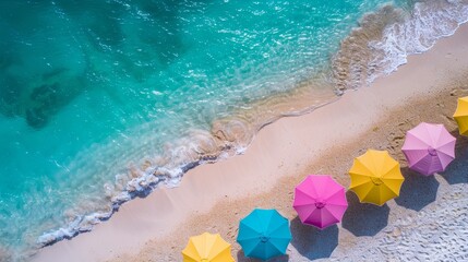 Vibrant beach umbrellas on pristine sand with crystal clear water create a joyful ambiance