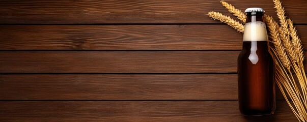 A beer bottle on a wooden background with wheat, perfect for beverage-themed designs.