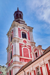 Fototapeta premium Courtyard and bell tower of the basilica Collegiate Church or simply know as Fara. It is a Roman Catholic basilica located in the heart of the Old Town district in Poznan, Europe, Poland