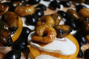 Homemade pizza with shrimp and olives