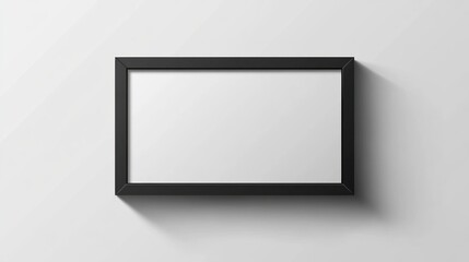 Black frame mockup on white wall.