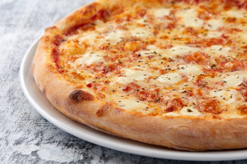 fresh pizza on the white plate