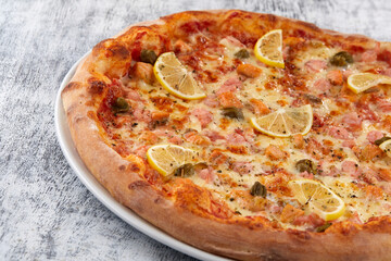 fresh pizza on the white plate
