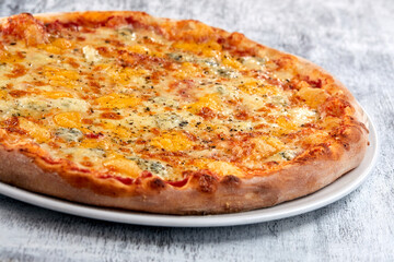 fresh pizza on the white plate