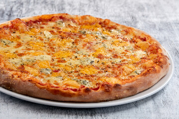 fresh pizza on the white plate