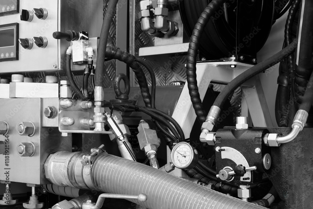 Poster a close up of a machine with many tubes and valves. the tubes are connected to a pump and the valves
